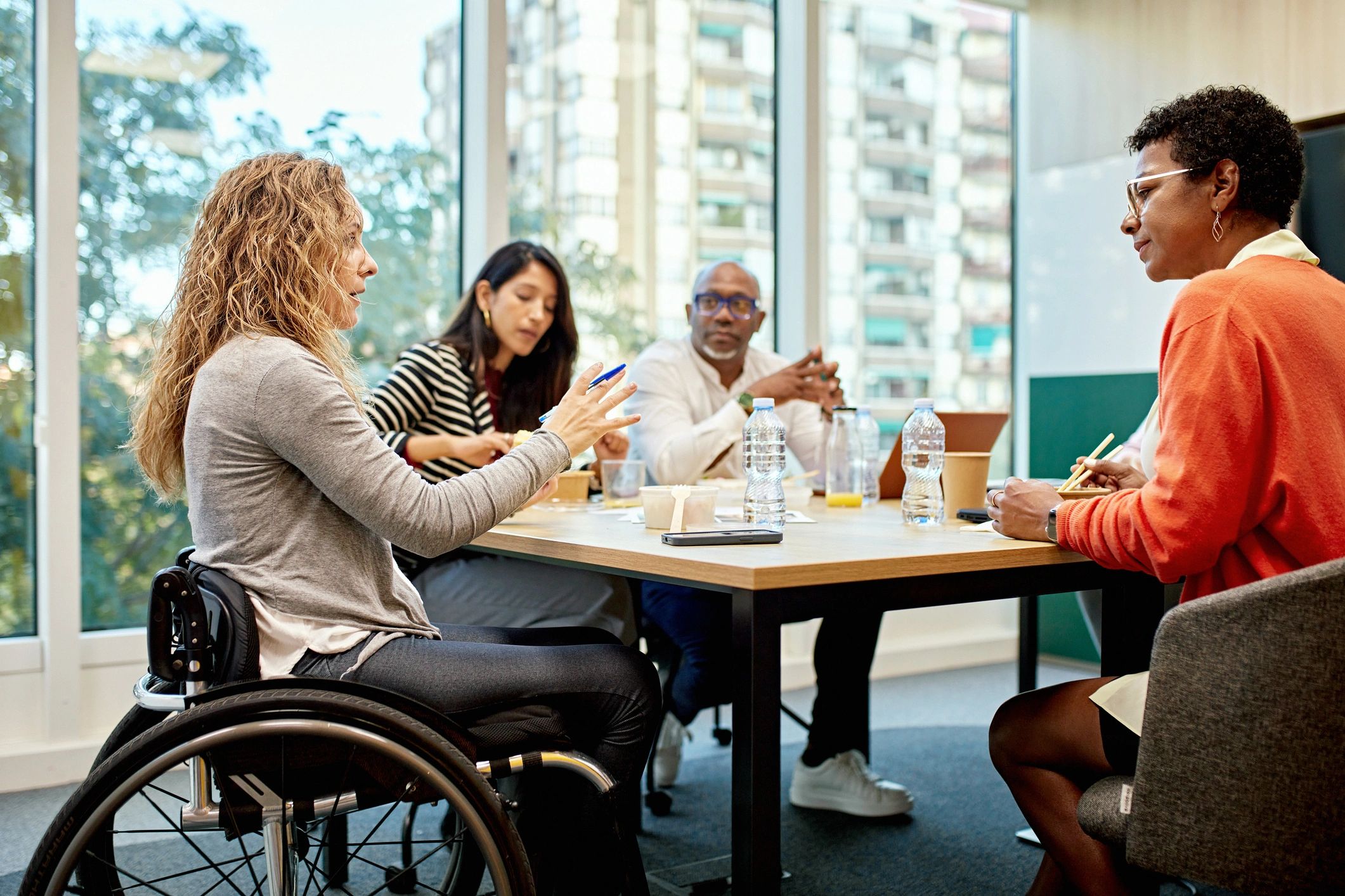 Professionals discussing ideas around a conference table